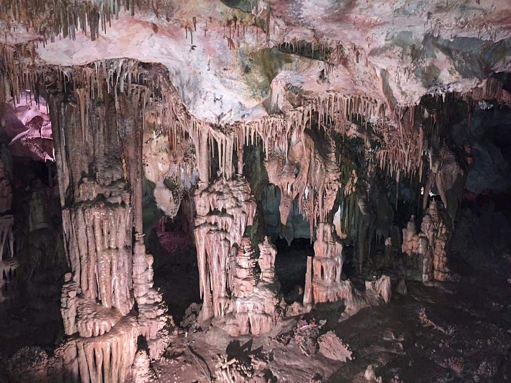 Lehman Caves formations illuminated with pink light in Great Basin National Park, part of a 14-day coast to coast national park road trip