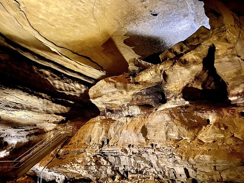 Mammoth Cave National Park, a destination for the best coast to coast national parks road trip, seen illuminated in the Gothic Avenue section