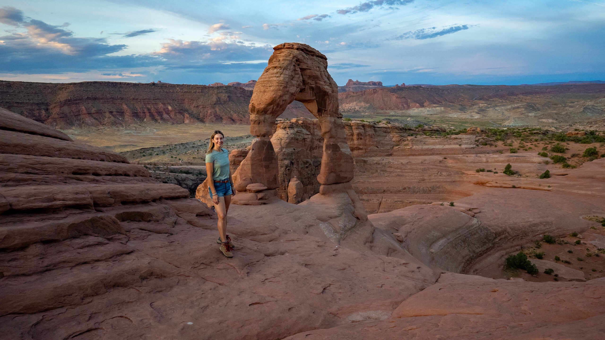 Woman at Delicate Arch in Arches National park Utah  
