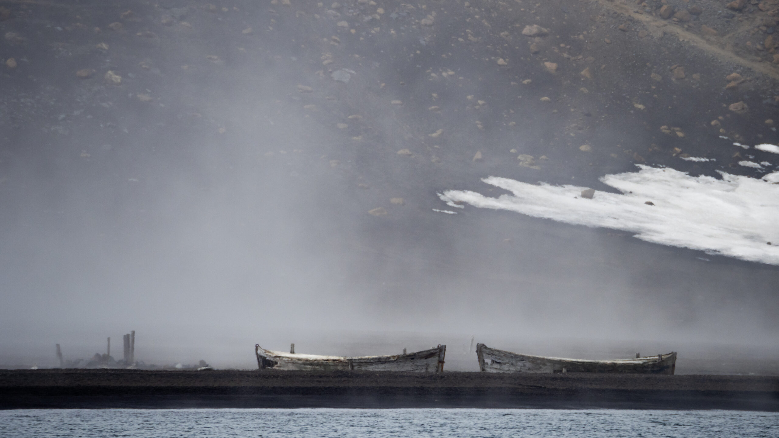 ancient boats from fisherman sit beached on deception island 
