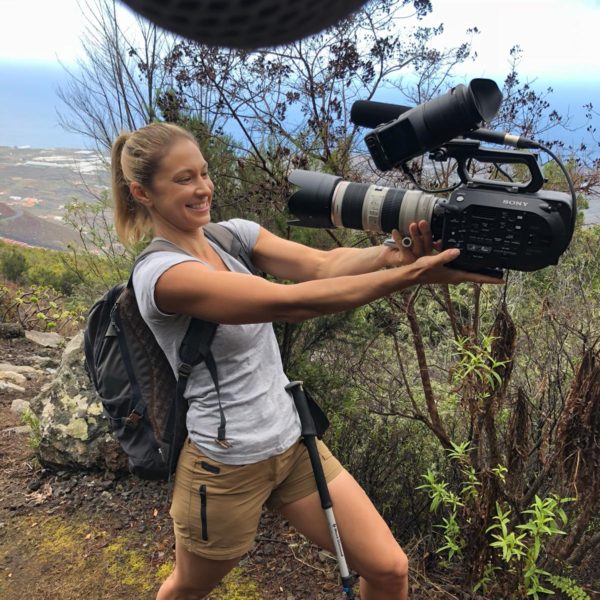 Alice holding a camera while on location in the Canary Islands.