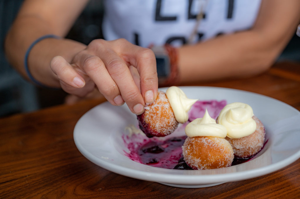 Bonuts with raspberry sauce with frosting on top at Biscuit Love