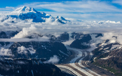 Aerial view over fog-shrouded Mt. McKinley in Denali National Park, one of the famous Alaska national parks in a 10-day road trip guide across the state