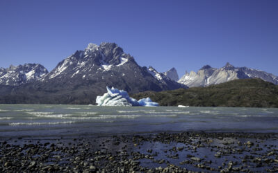 An iceberg on the shores of Lago grey in Torres Del Paine National Park. Lago Grey Hotel Patagonia Alice's Adventures On Earth