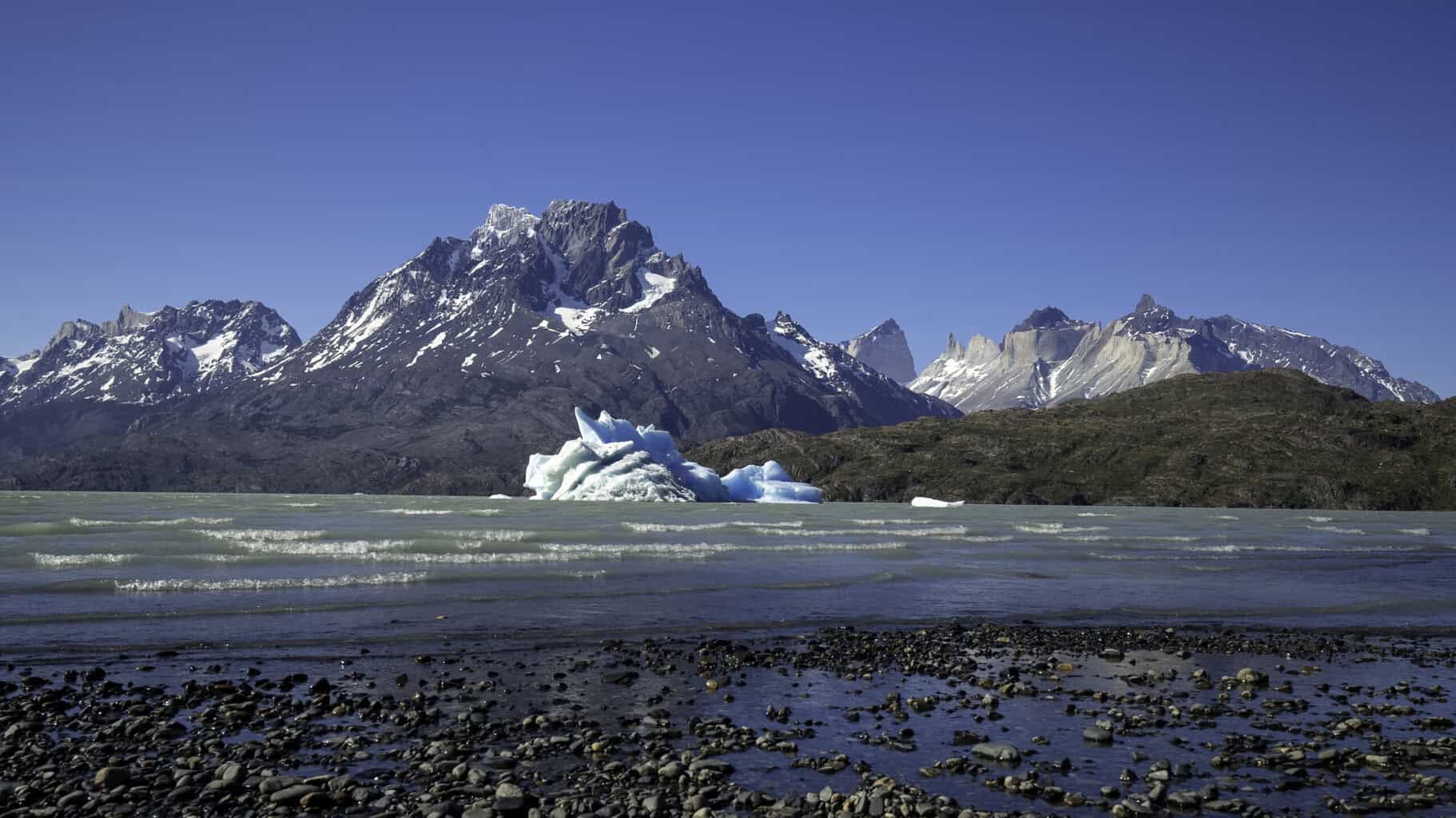 An iceberg on the shores of Lago grey in Torres Del Paine National Park. Lago Grey Hotel Patagonia Alice's Adventures On Earth