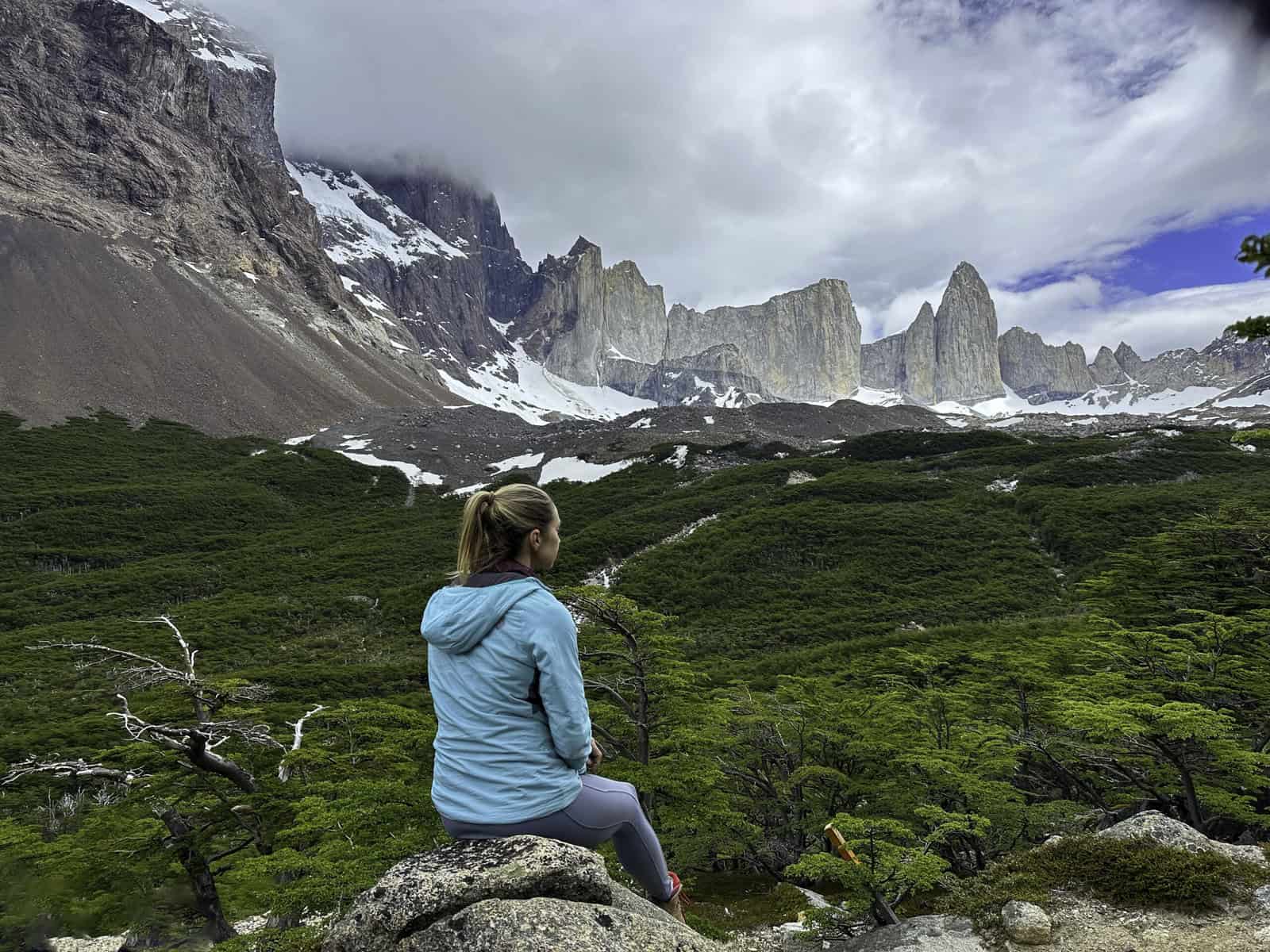 Women sits admiring the view at Britanico Viewpoint along the W Trek 