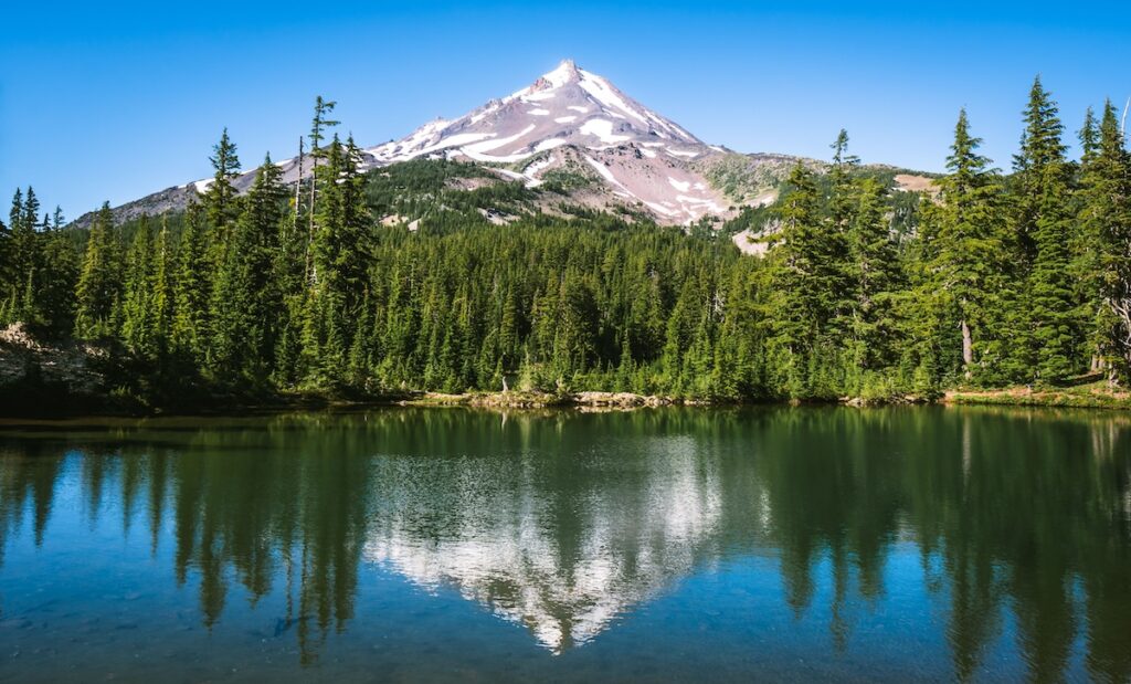 Mt. Hood seen reflected in Mirror Lake from Mirror Lake Trail, a key part of a 7-day itinerary through Pacific Northwest national parks