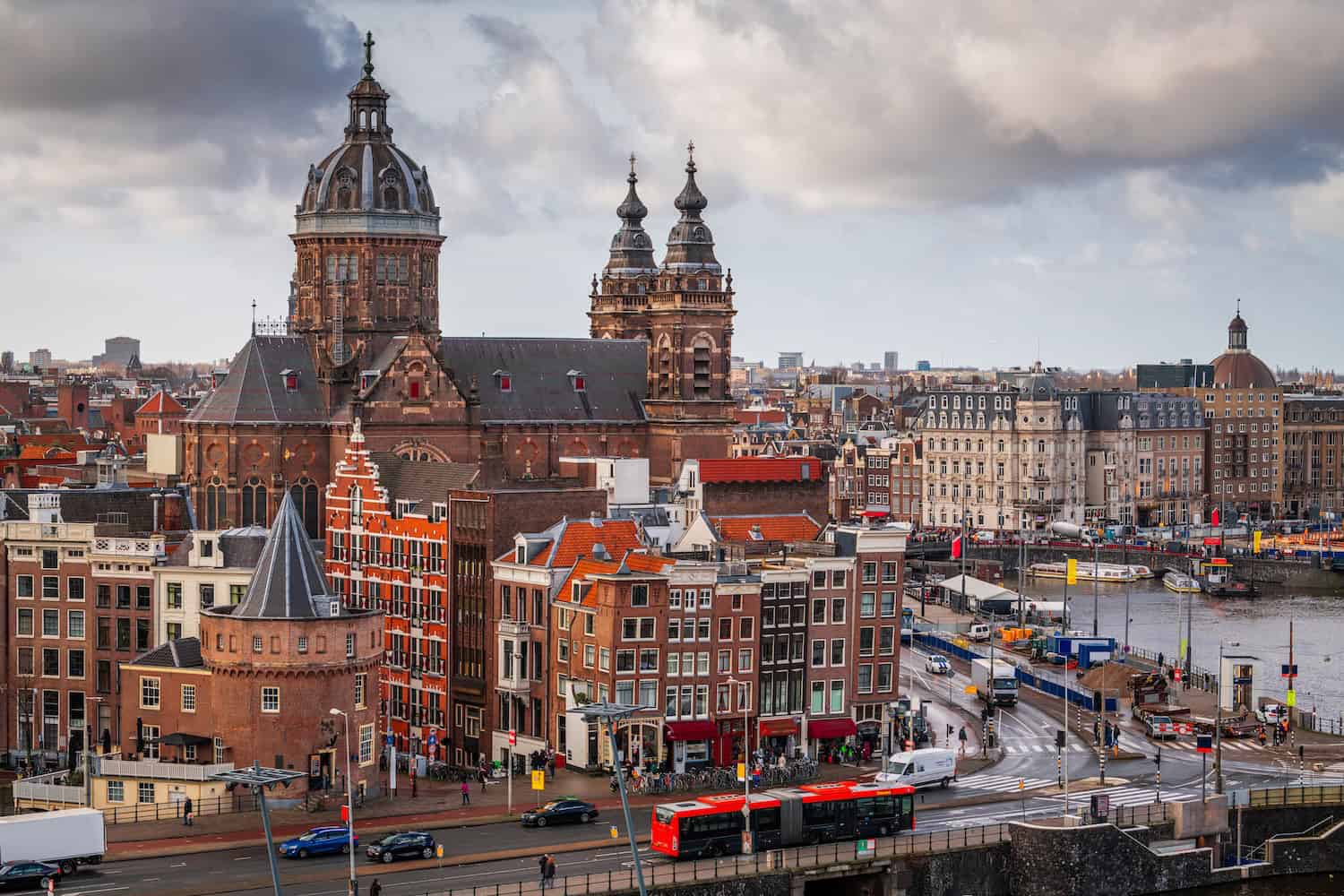 Amsterdam, Netherlands town cityscape over the Old Centre District with Basilica of Saint Nicholas.