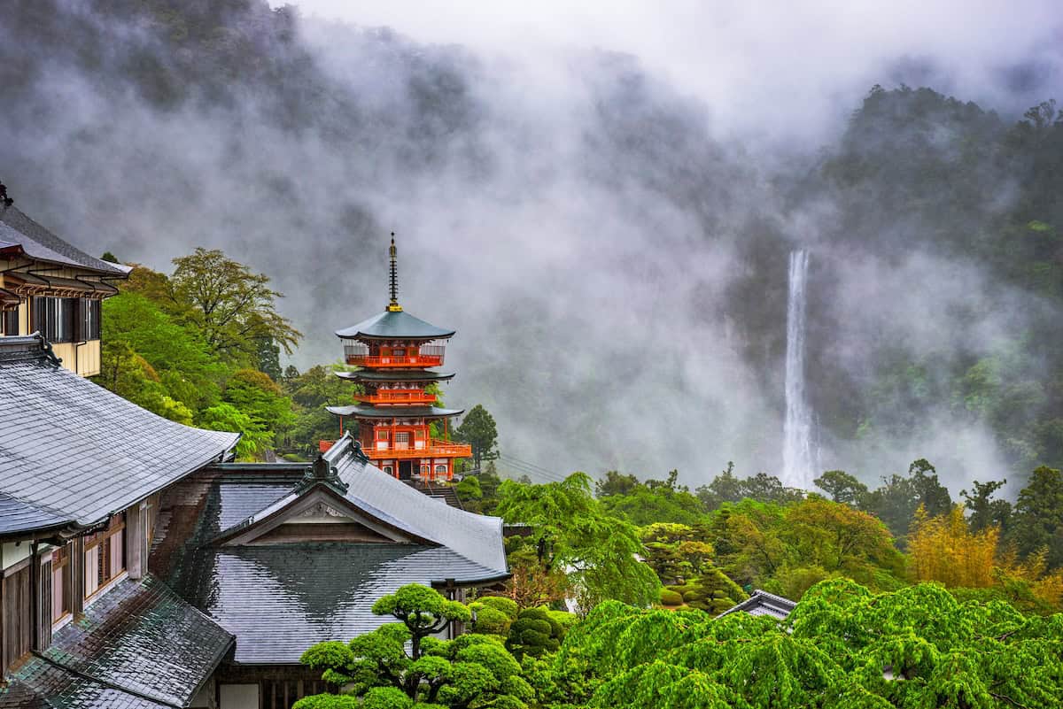 View of Nachi Taisha Shrine with fog settled around it in Nachi, Wakayama on the Kumano Kodo Pilgrimage Trail for a list of the best destinations for adventure in Japan