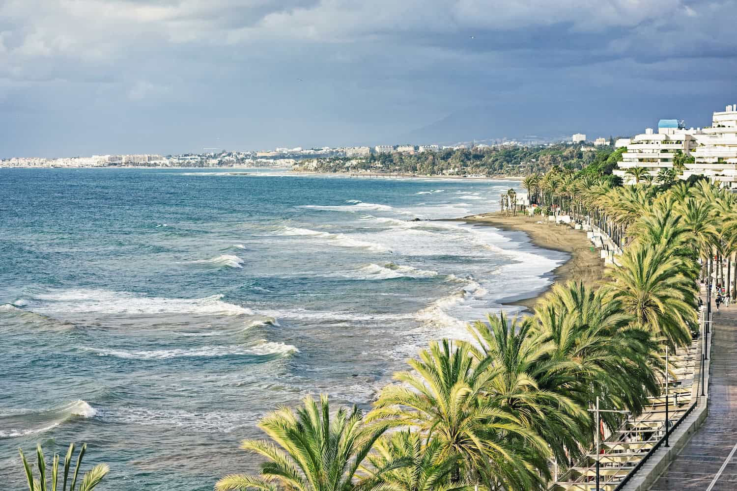 panoramic view of Marbella promenade and stormy sea, Spain resort in January