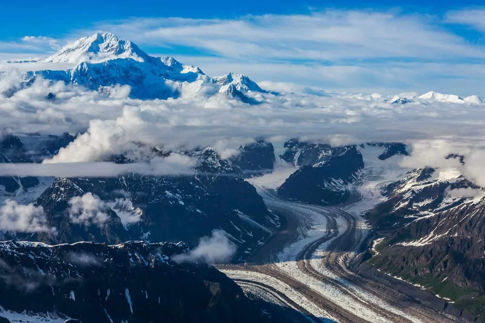 Denali rising above glaciers and cloud