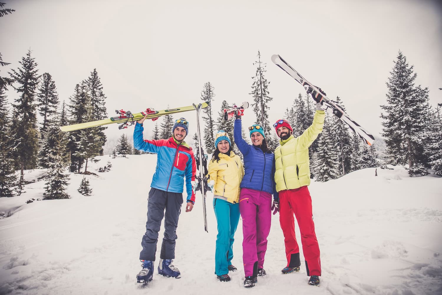 Group of friends with ski on winter holidays - Skiers having fun on the snow